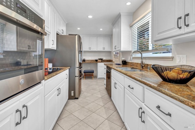 168 Bergwall Way, Vallejo, CA 94591 - kitchen featuring appliances with stainless steel finishes, white cabinetry, light tile patterned flooring, recessed lighting, and stone counters