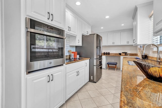 168 Bergwall Way, Vallejo, CA 94591 - kitchen featuring stainless steel appliances, white cabinets, recessed lighting, light tile patterned floors, and decorative backsplash