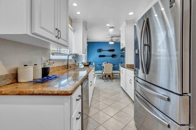 168 Bergwall Way, Vallejo, CA 94591 - kitchen with stainless steel appliances, ceiling fan, recessed lighting, white cabinetry, and light tile patterned floors