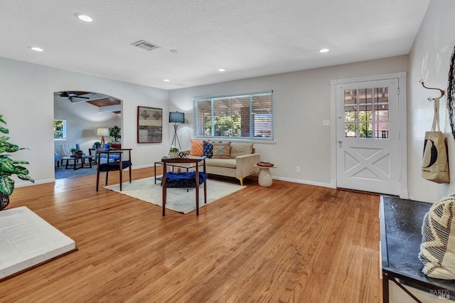 168 Bergwall Way, Vallejo, CA 94591 - living area featuring plenty of natural light, light wood finished floors, arched walkways, recessed lighting, and a textured ceiling