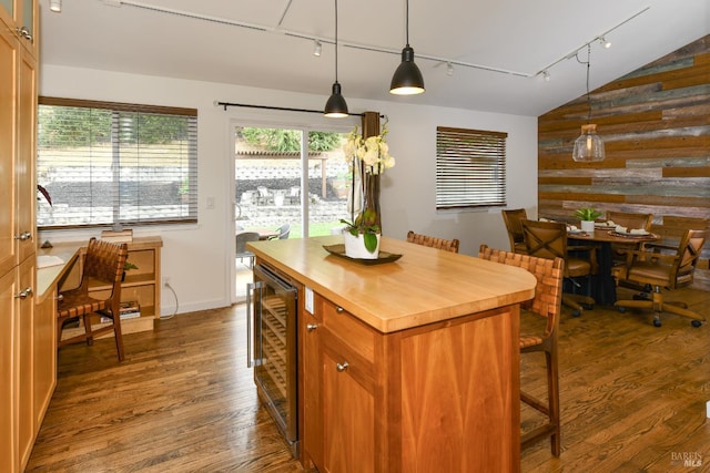 1006 Birkdale Dr, Napa, CA 94559 - kitchen featuring rail lighting, butcher block countertops, wine cooler, dark wood-type flooring, and a kitchen bar