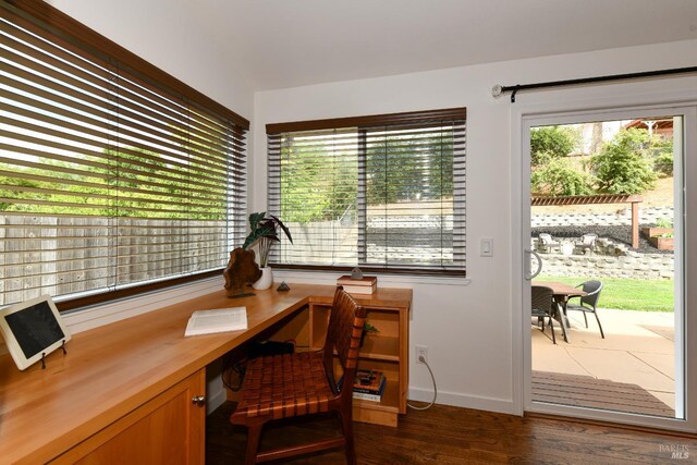 1006 Birkdale Dr, Napa, CA 94559 - office featuring healthy amount of natural light, dark wood-style floors, built in desk, and baseboards