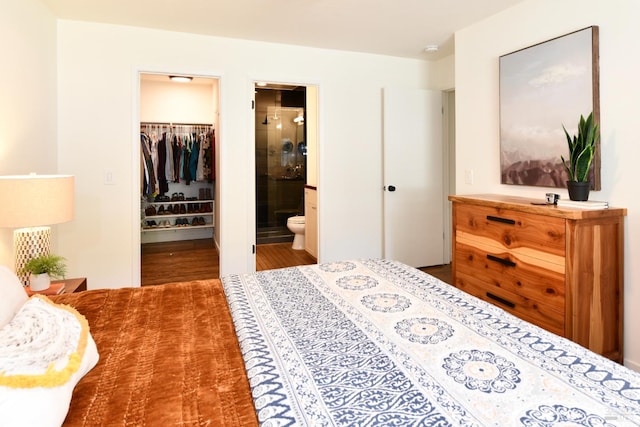 1006 Birkdale Dr, Napa, CA 94559 - bedroom featuring a spacious closet, wood finished floors, a closet, and connected bathroom