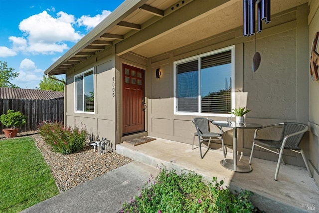 1006 Birkdale Dr, Napa, CA 94559 - view of exterior entry with fence, stucco siding, and a patio
