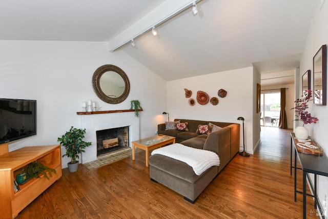 1006 Birkdale Dr, Napa, CA 94559 - living area featuring track lighting, wood finished floors, and a fireplace with flush hearth