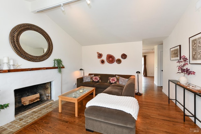 1006 Birkdale Dr, Napa, CA 94559 - living room with wood finished floors, rail lighting, a fireplace, and lofted ceiling