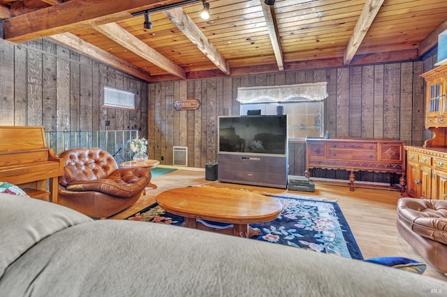 1324 Delwood St, Vallejo, CA 94591 - living room with wooden walls, wood finished floors, beamed ceiling, rail lighting, and wooden ceiling