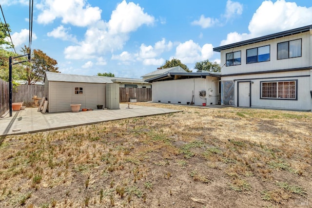 1324 Delwood St, Vallejo, CA 94591 - rear view of house featuring a patio, a fenced backyard, and an outbuilding