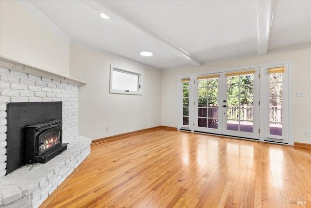 2787 N Fitch Mountain Rd, Healdsburg, CA 95448 - unfurnished living room featuring light wood-style floors, beam ceiling, baseboards, french doors, and ornamental molding