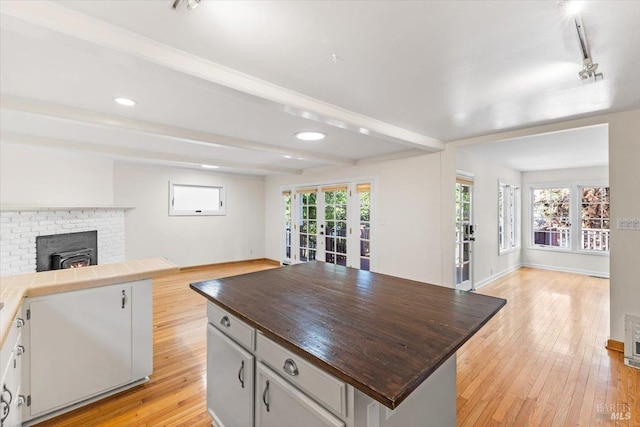 2787 N Fitch Mountain Rd, Healdsburg, CA 95448 - kitchen featuring open floor plan, french doors, light wood finished floors, wooden counters, and a center island