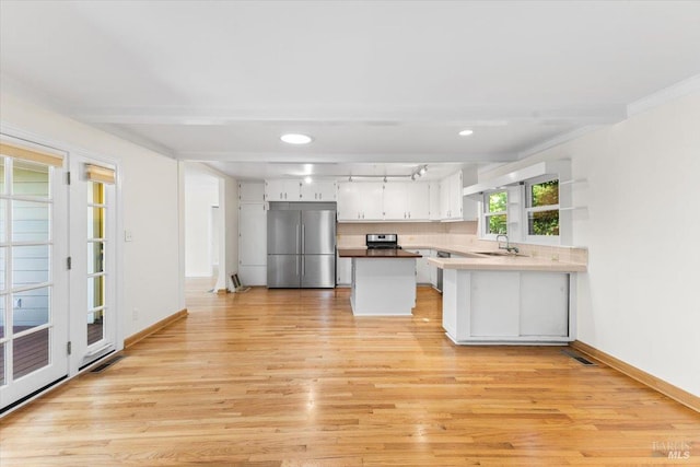 2787 N Fitch Mountain Rd, Healdsburg, CA 95448 - kitchen with high end fridge, light wood finished floors, baseboards, and recessed lighting
