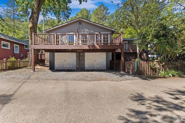 2787 N Fitch Mountain Rd, Healdsburg, CA 95448 - view of front of property featuring a wooden deck, driveway, and a garage