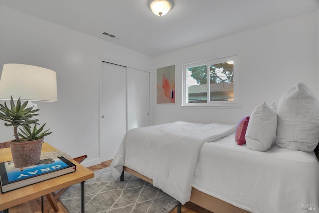 bedroom with a closet and wood finished floors