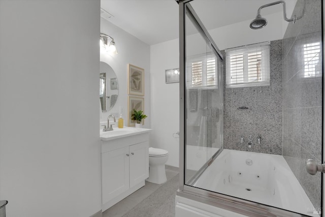 bathroom featuring toilet, a tub with jets, a shower with shower door, and vanity