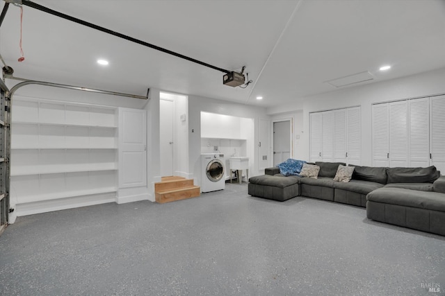 living room with washer / dryer, recessed lighting, speckled floor, and a garage
