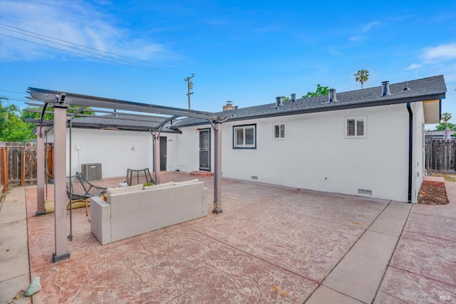 rear view of house featuring a pergola, crawl space, cooling unit, fence, and stucco siding