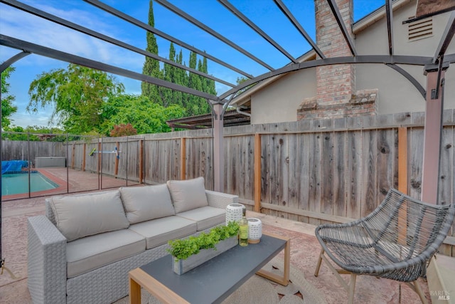 view of patio with outdoor lounge area, a fenced backyard, and a pergola
