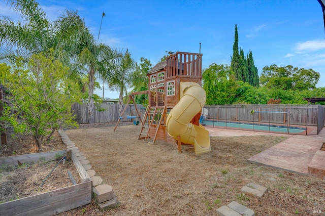 view of playground with a fenced backyard