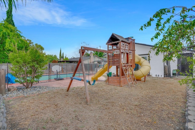 communal playground featuring fence