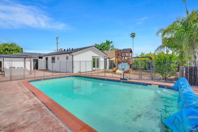 view of pool featuring fence