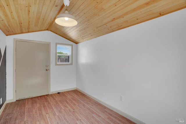 additional living space featuring wood ceiling, lofted ceiling, light wood-type flooring, and baseboards