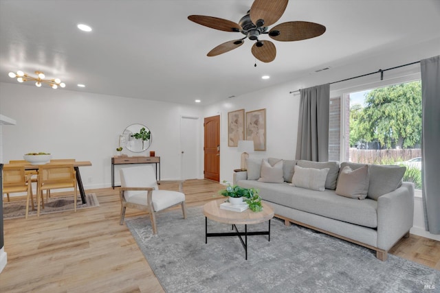 living area featuring a ceiling fan, light wood finished floors, recessed lighting, and baseboards