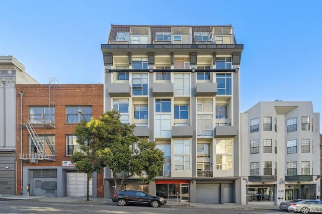 view of apartment building / complex with an attached garage