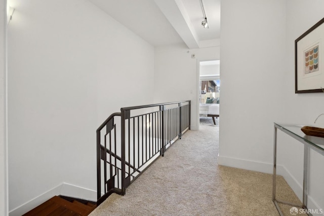 1452 Bush St Unit 9, San Francisco, CA 94109 - hall featuring an upstairs landing, baseboards, carpet flooring, and rail lighting