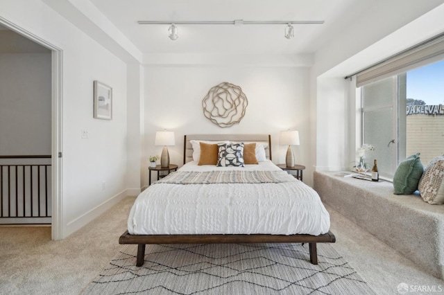 1452 Bush St Unit 9, San Francisco, CA 94109 - bedroom with light colored carpet, track lighting, and baseboards
