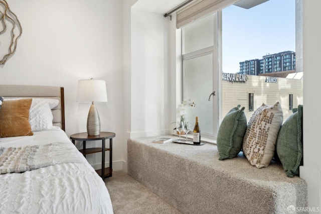 carpeted bedroom featuring baseboards