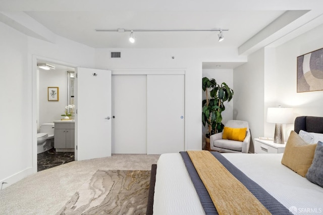 1452 Bush St Unit 9, San Francisco, CA 94109 - bedroom with ensuite bath, track lighting, a closet, and carpet flooring