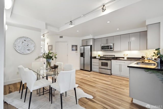 1452 Bush St Unit 9, San Francisco, CA 94109 - dining area with light wood-type flooring, rail lighting, baseboards, and recessed lighting