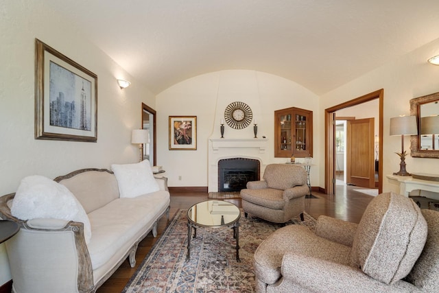 2110 3rd St, Napa, CA 94559 - living room featuring dark wood finished floors, a fireplace, baseboards, and vaulted ceiling