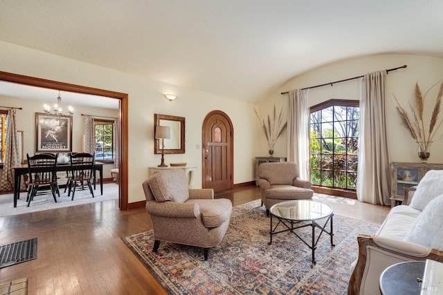 2110 3rd St, Napa, CA 94559 - living room featuring plenty of natural light, lofted ceiling, a chandelier, hardwood / wood-style floors, and baseboards