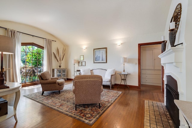 2110 3rd St, Napa, CA 94559 - living area with a fireplace with flush hearth, lofted ceiling, hardwood / wood-style floors, and baseboards