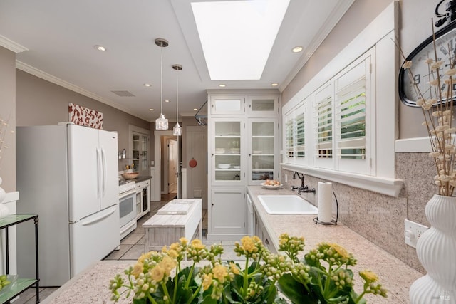 2110 3rd St, Napa, CA 94559 - kitchen with white appliances, decorative backsplash, light countertops, ornamental molding, and a skylight