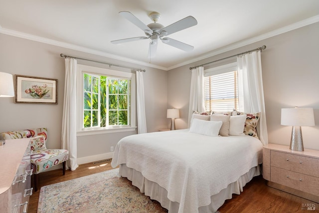 2110 3rd St, Napa, CA 94559 - bedroom featuring crown molding, multiple windows, wood finished floors, baseboards, and a ceiling fan