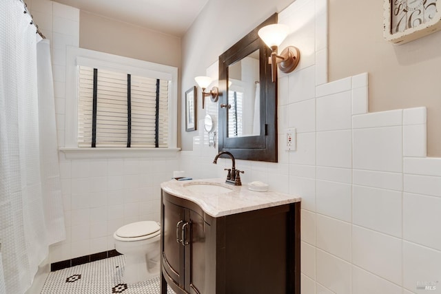 2110 3rd St, Napa, CA 94559 - bathroom featuring tile walls, toilet, vanity, a shower with curtain, and tile patterned floors