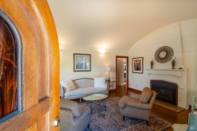 2110 3rd St, Napa, CA 94559 - living area with wood finished floors, a glass covered fireplace, vaulted ceiling, and baseboards