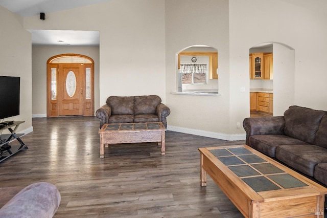 9260 Leila Dr, Glenhaven, CA 95443 - living area featuring wood finished floors, baseboards, and high vaulted ceiling