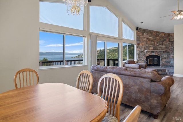 9260 Leila Dr, Glenhaven, CA 95443 - dining area with healthy amount of natural light, wood finished floors, a ceiling fan, a water view, and a towering ceiling
