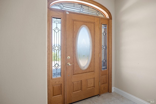 9260 Leila Dr, Glenhaven, CA 95443 - foyer with baseboards, healthy amount of natural light, and light tile patterned flooring