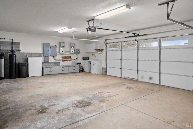 9260 Leila Dr, Glenhaven, CA 95443 - garage with a garage door opener and electric panel