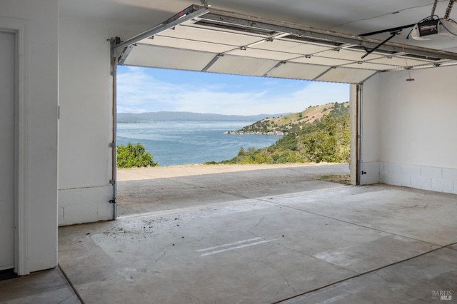 9260 Leila Dr, Glenhaven, CA 95443 - garage featuring a water view and a garage door opener
