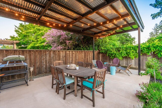 3355 Covey Ct, Napa, CA 94558 - view of patio featuring a fenced backyard, outdoor dining space, and a fire pit