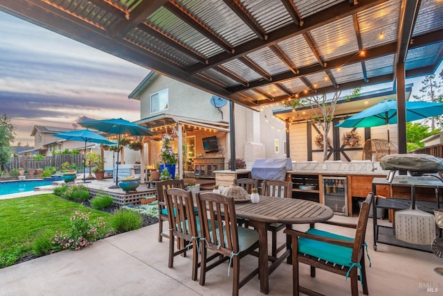 3355 Covey Ct, Napa, CA 94558 - view of patio / terrace with an outdoor kitchen, fence, outdoor dining area, wine cooler, and grilling area