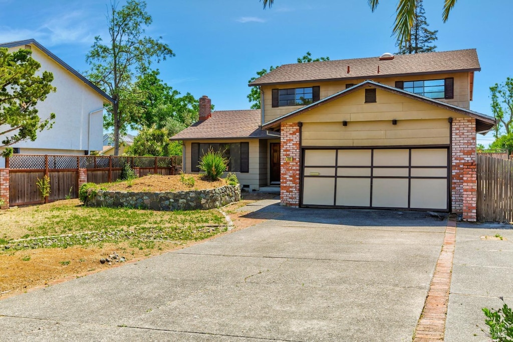 702 Glenhill Ct, Novato, CA 94947 - view of front of house featuring driveway, a garage, brick siding, and a chimney