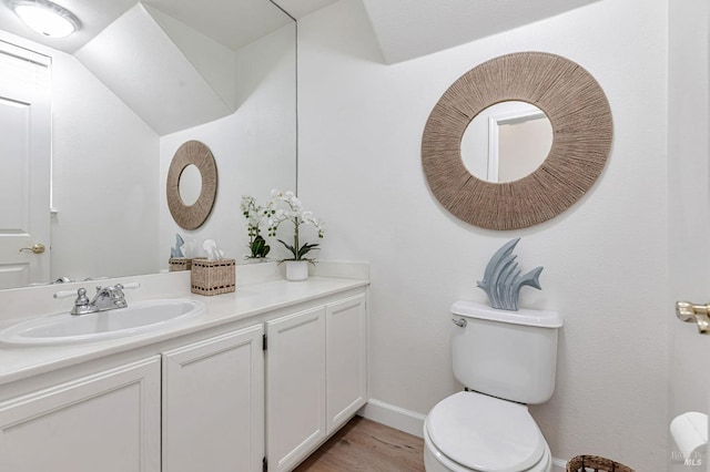2064 Easton Dr, Petaluma, CA 94952 - half bath featuring toilet, wood finished floors, vanity, and baseboards