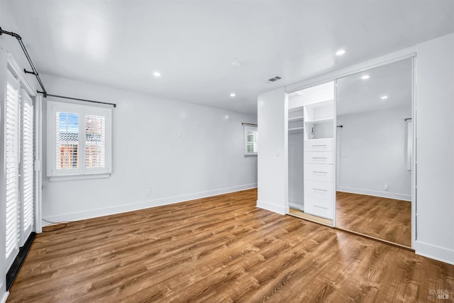 1444 Ohio St, Vallejo, CA 94590 - unfurnished bedroom with wood finished floors, baseboards, recessed lighting, and a closet