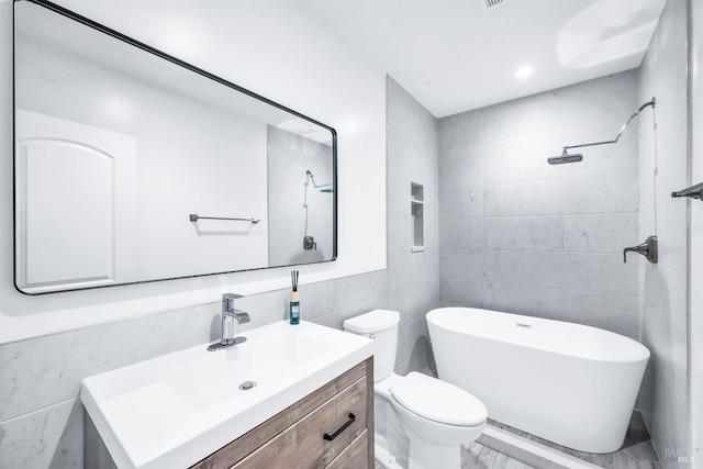 1444 Ohio St, Vallejo, CA 94590 - bathroom with tile walls, vanity, marble finish flooring, a freestanding bath, and toilet
